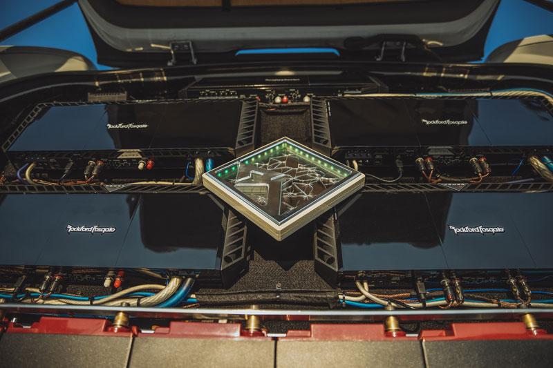 Rockford Fosgate amplifier setup with multiple units in a car trunk for premium sound