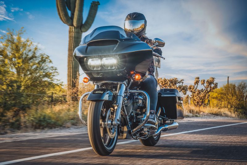Rider on a Harley-Davidson with Rockford Fosgate Harley kit audio on a desert road